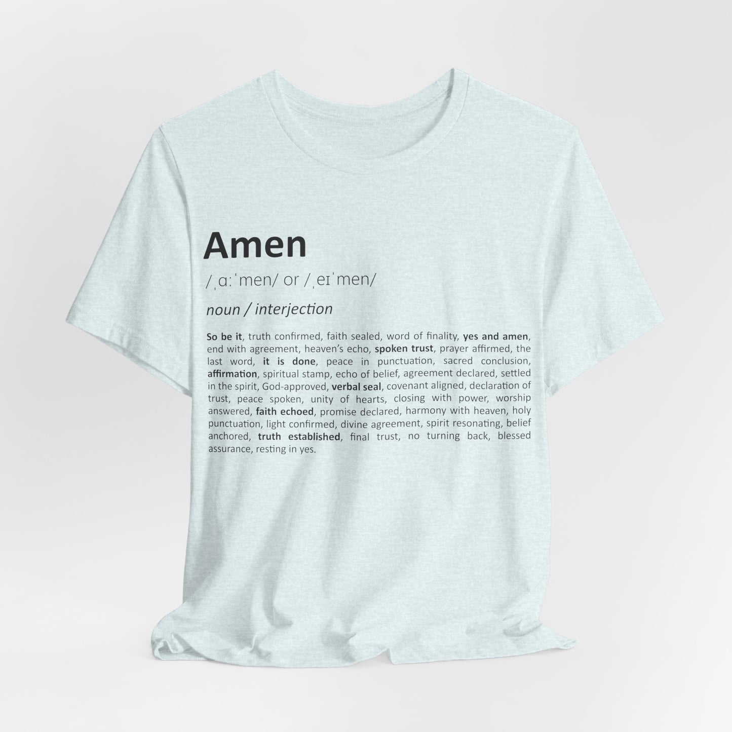 White t-shirt with black text on a light pink background