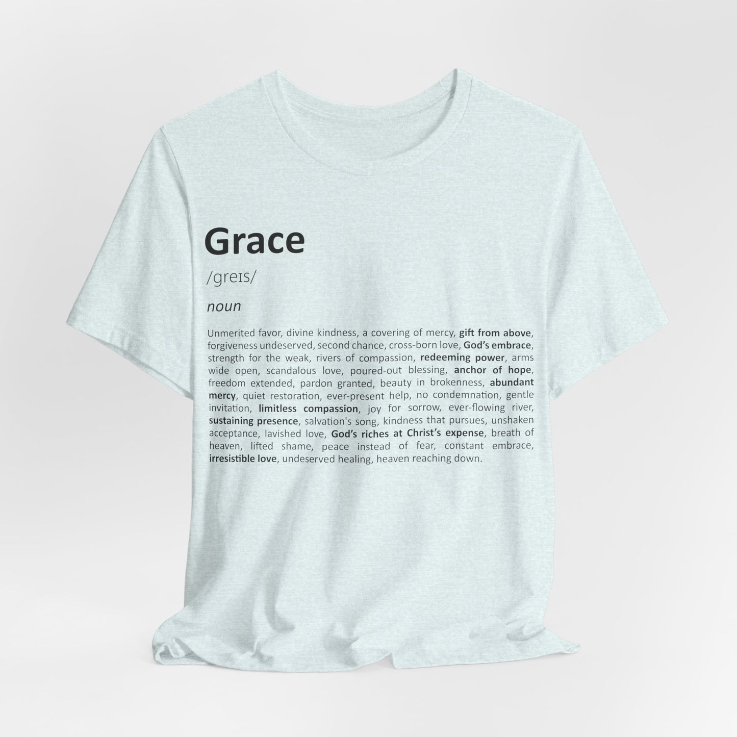 White t-shirt with 'Grace' definition text on a light pink background