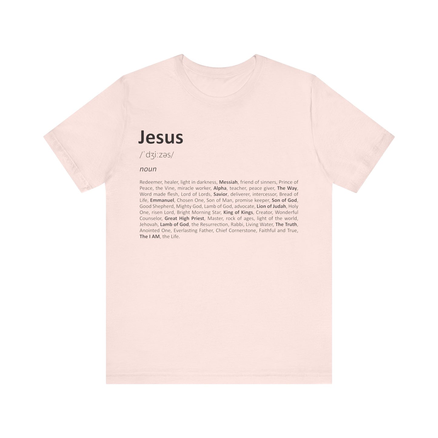 Pink t-shirt with text definition of 'Jesus' on a white background