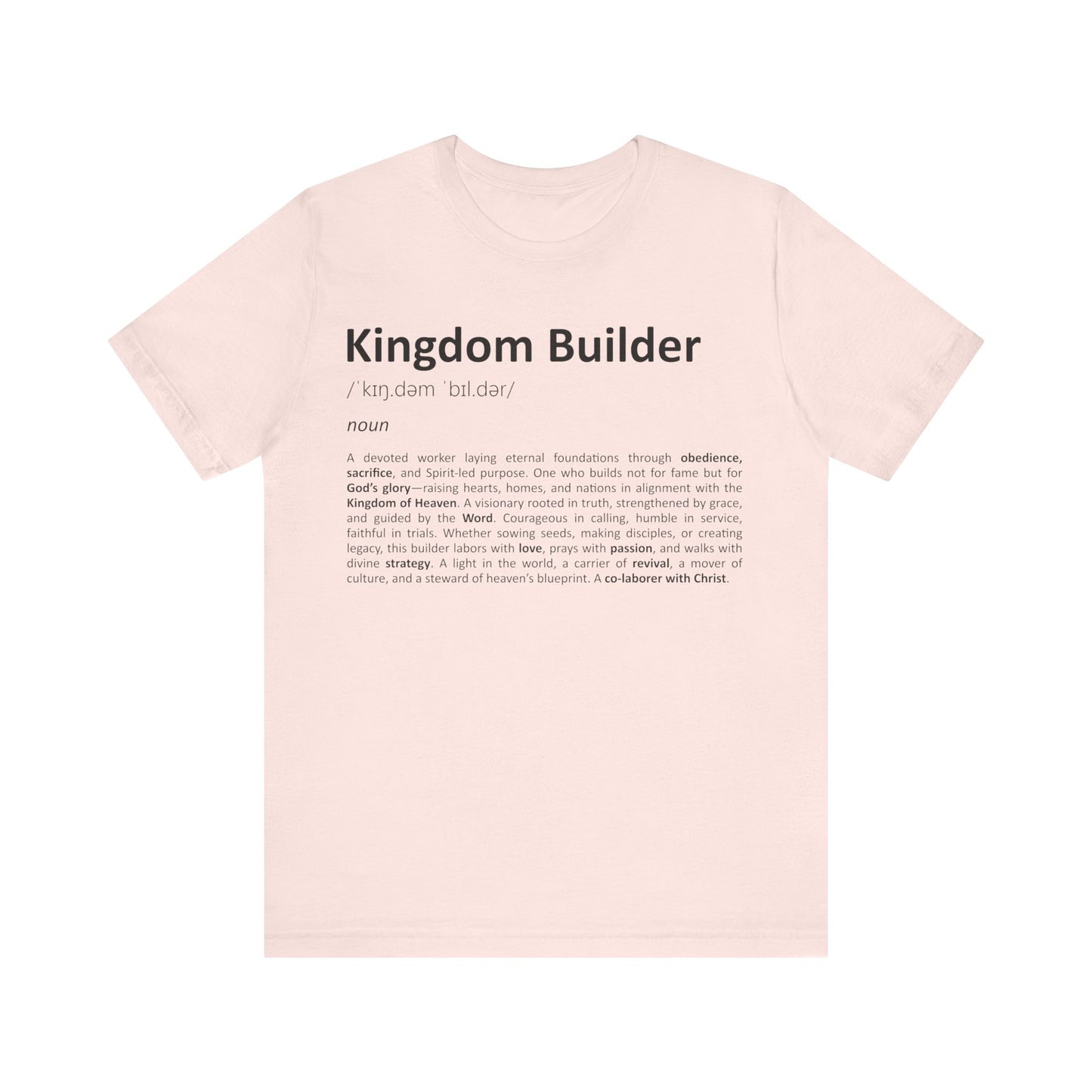 Pink t-shirt with 'Kingdom Builder' definition text on a white background