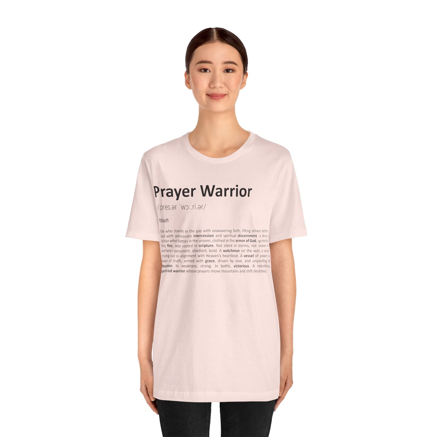 Person wearing a pink t-shirt with 'Prayer Warrior' text on a white background