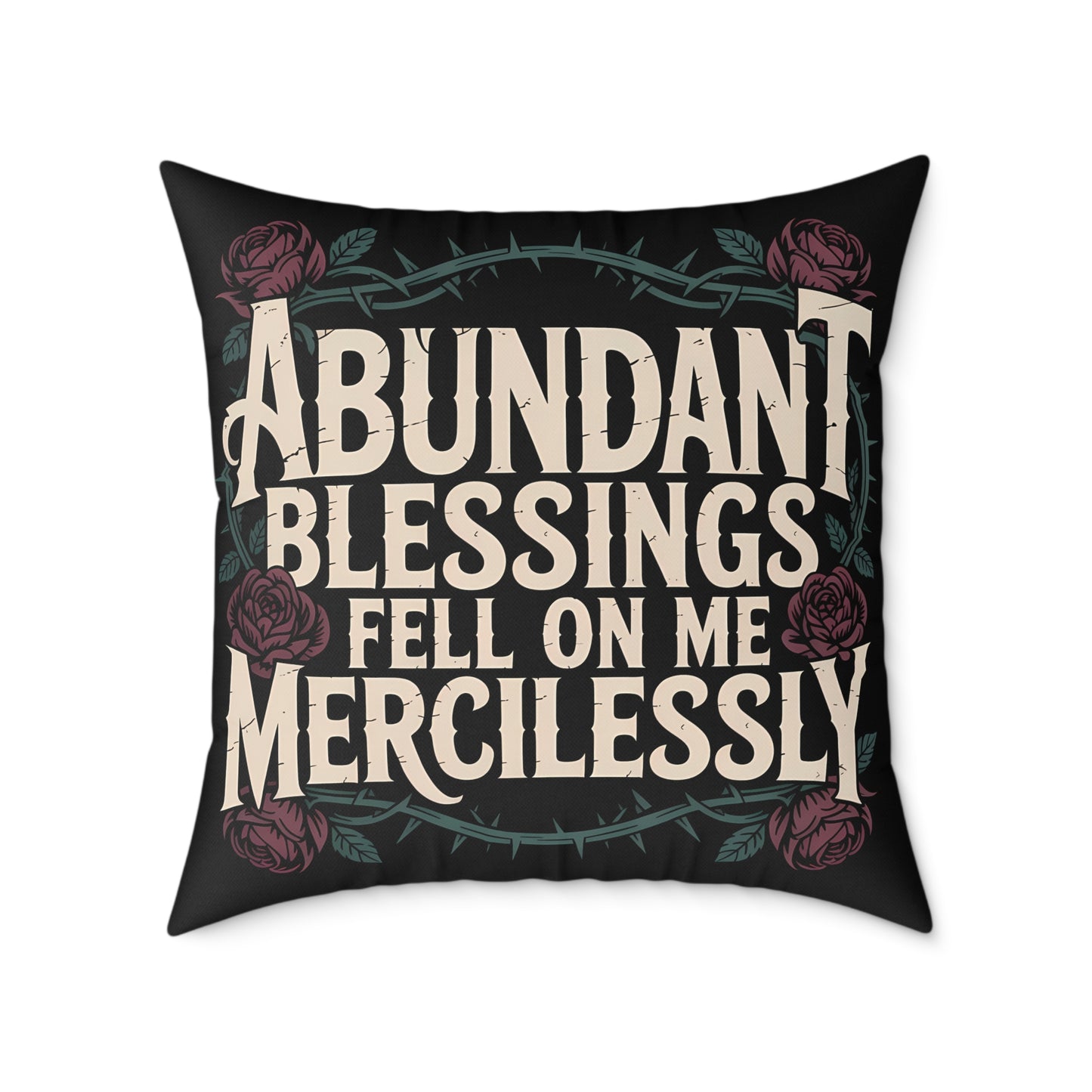 Decorative pillow with text 'Abundant Blessings Fell on Me Mercilessly' and floral design on a black background.