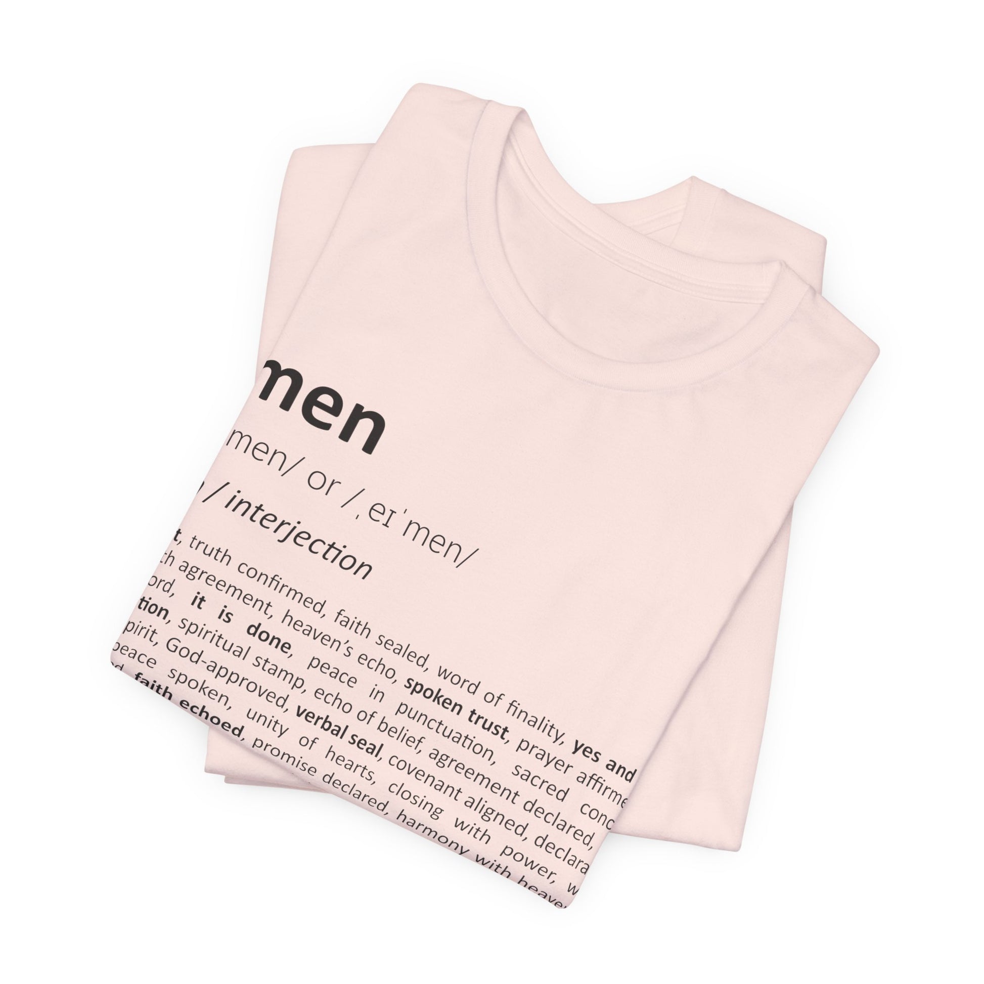 Folded pink t-shirt with black text on a white background