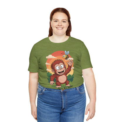Woman wearing a green t-shirt with a cartoon monkey design on a white background
