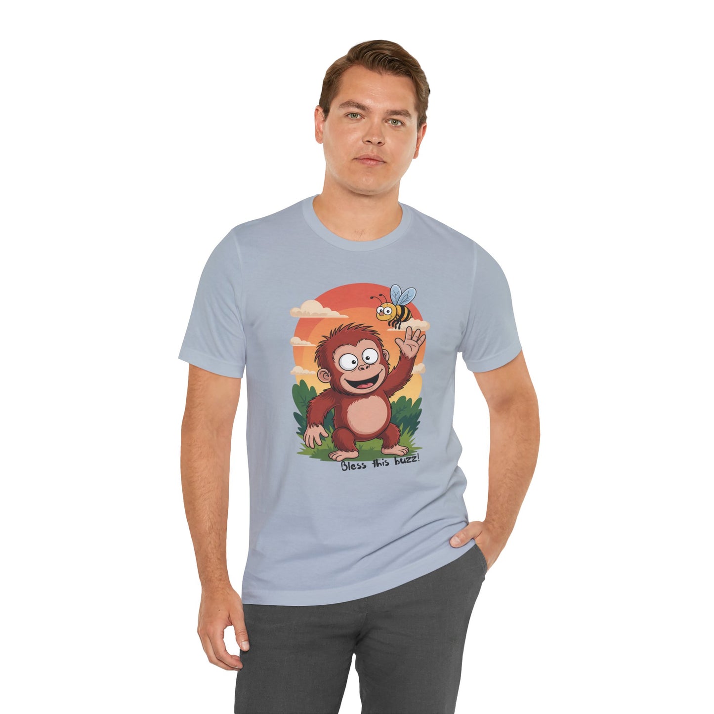 Man wearing a light blue t-shirt with a cartoon monkey design on a white background
