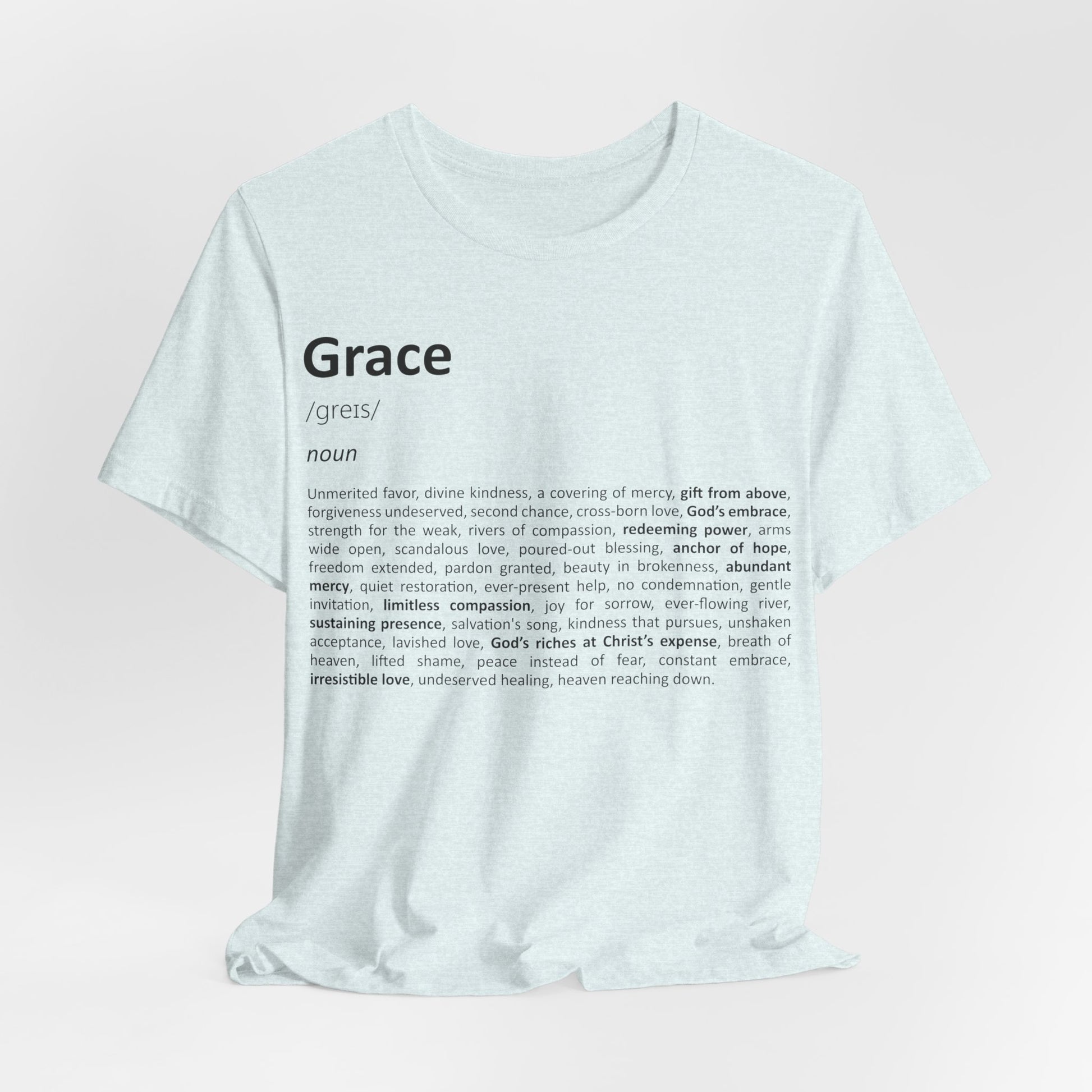 White t-shirt with 'Grace' definition text on a light pink background