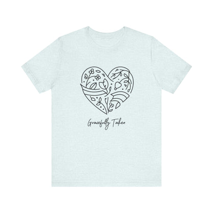 Light blue t-shirt with a heart-shaped design and 'Gracefully Taken' text on a white background