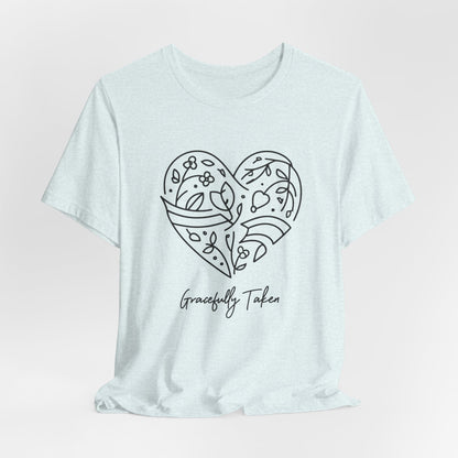 Light blue t-shirt with a heart design and 'Gracefully Taken' text on a light pink background