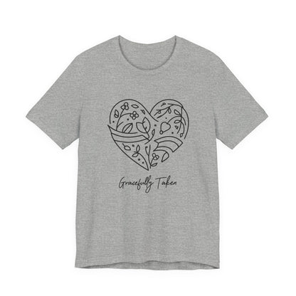 Gray t-shirt with a black heart design and 'Gracefully Taken' text on a white background