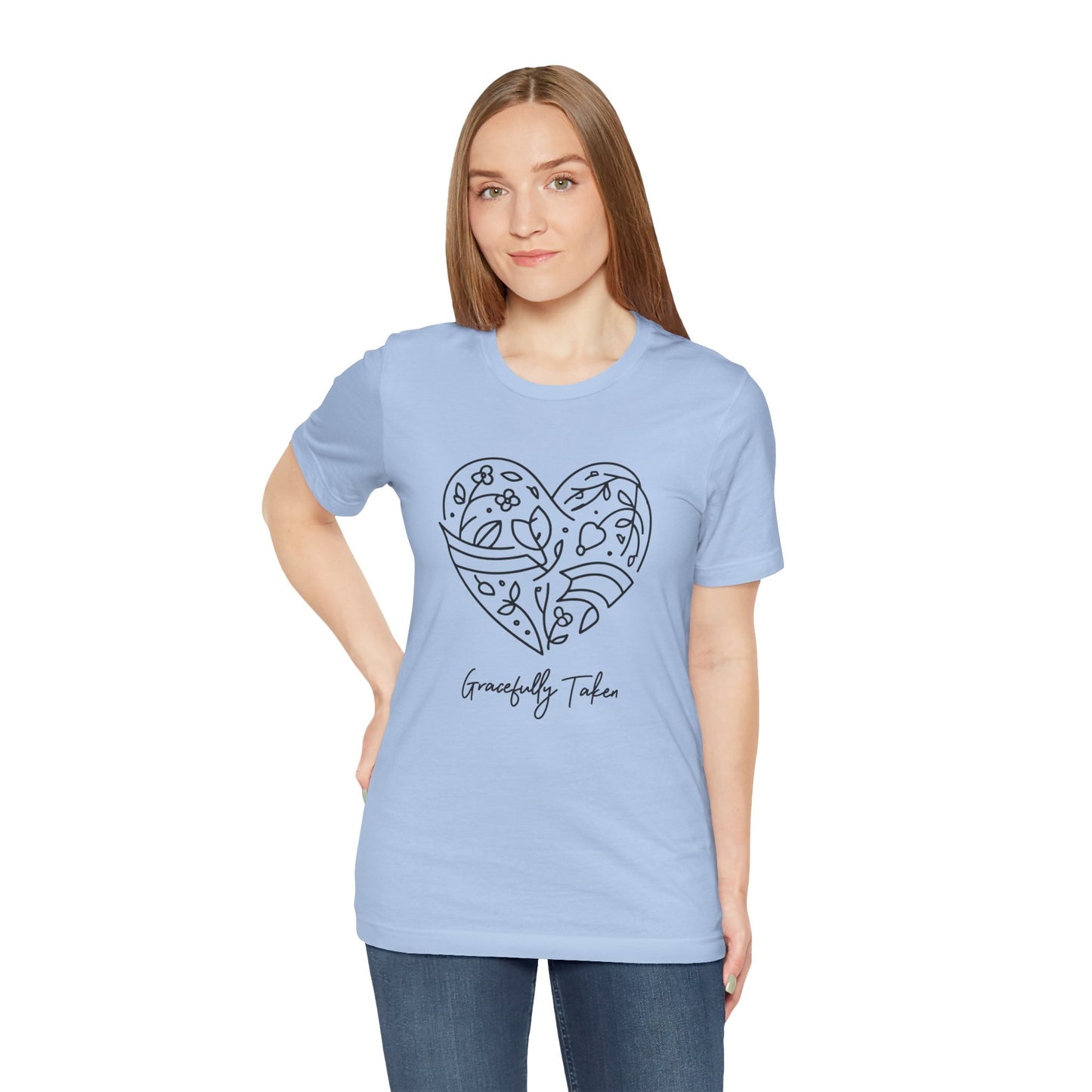 Woman wearing a light blue t-shirt with a heart design and text on a white background