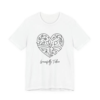 White t-shirt with a black heart design and 'Gracefully Taken' text on a white background