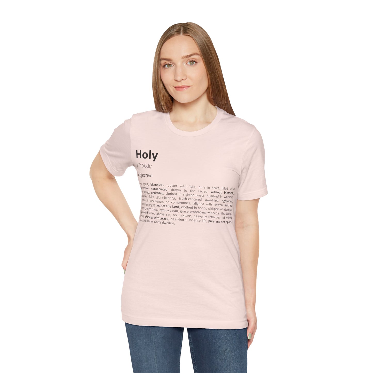 Woman wearing a light pink t-shirt with text on a white background