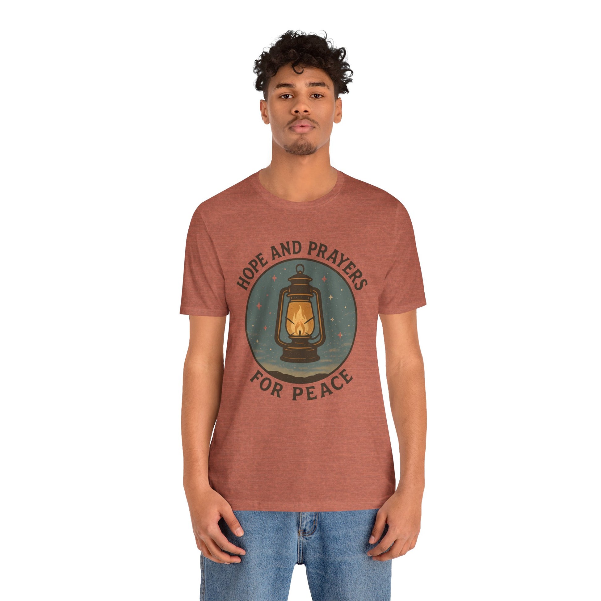 Person wearing a brown t-shirt with a graphic design and text on a white background