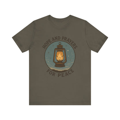Brown t-shirt with a lantern graphic and text 'Hope and Prayers for Peace' on a white background