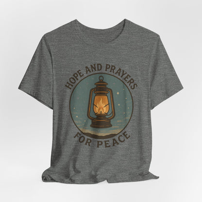Gray t-shirt with a graphic of a lantern and text 'Hope and Prayers for Peace' on a white background