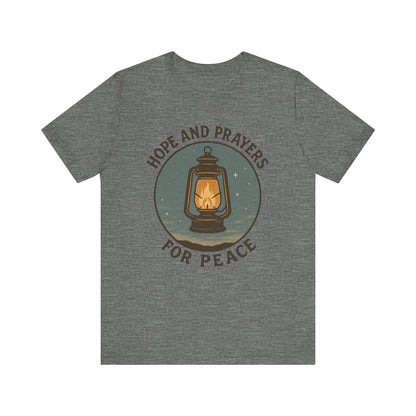 Gray t-shirt with a lantern graphic and text 'Hope and Prayers for Peace' on a white background