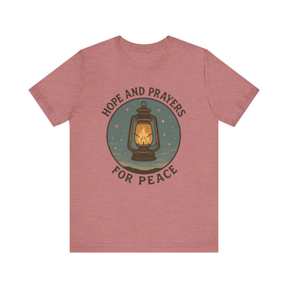 Red t-shirt with a lantern graphic and text 'Hope and Prayers for Peace' on a white background