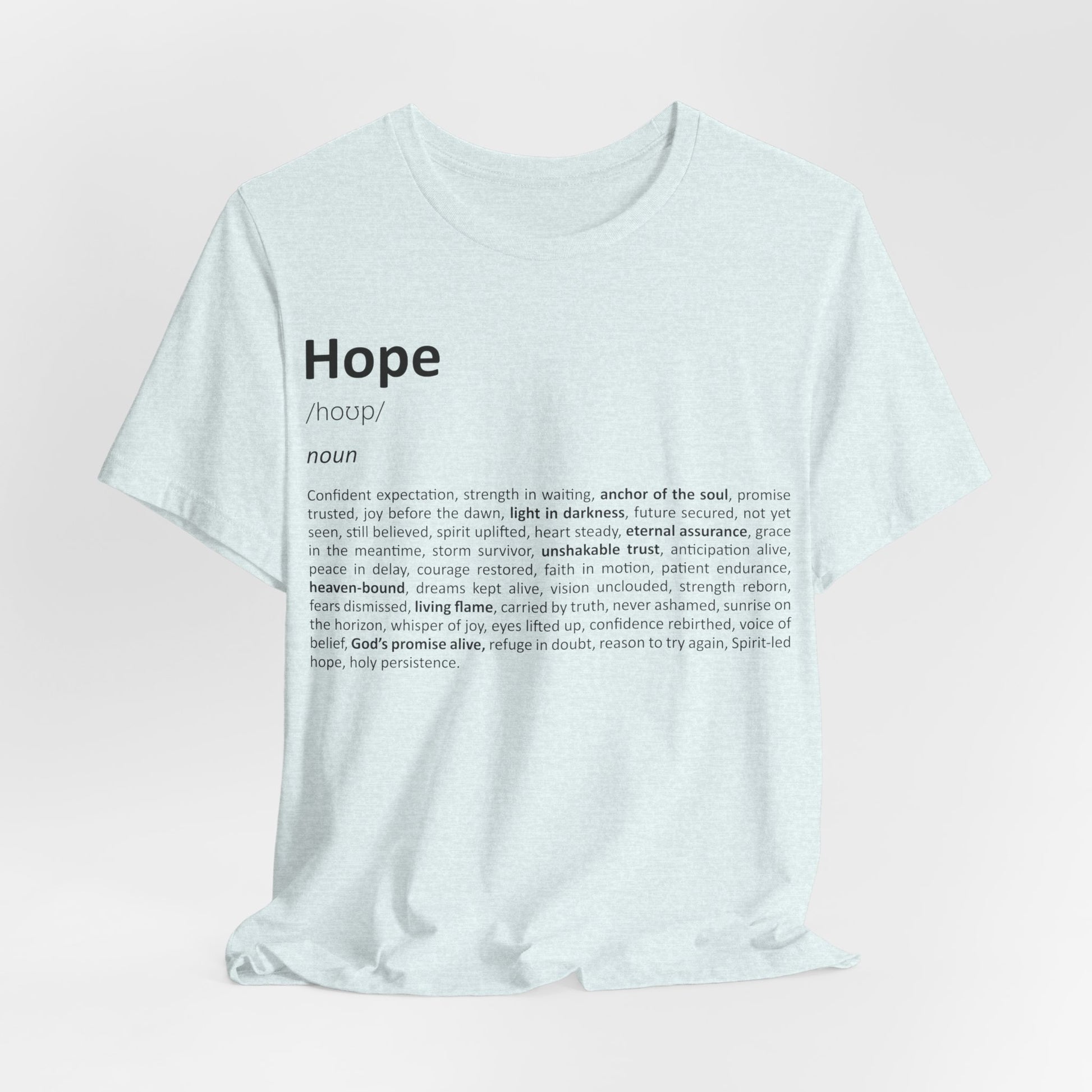 White t-shirt with 'Hope' definition printed on a light pink background