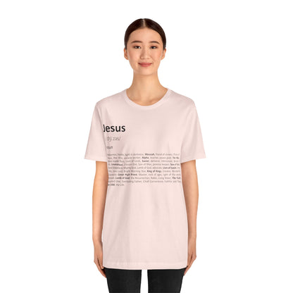 Person wearing a light pink t-shirt with text on a white background