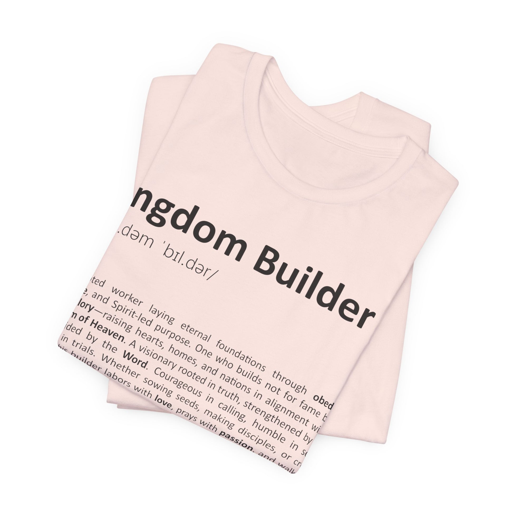 Pink tank top with 'Kingdom Builder' text and definition on a white background