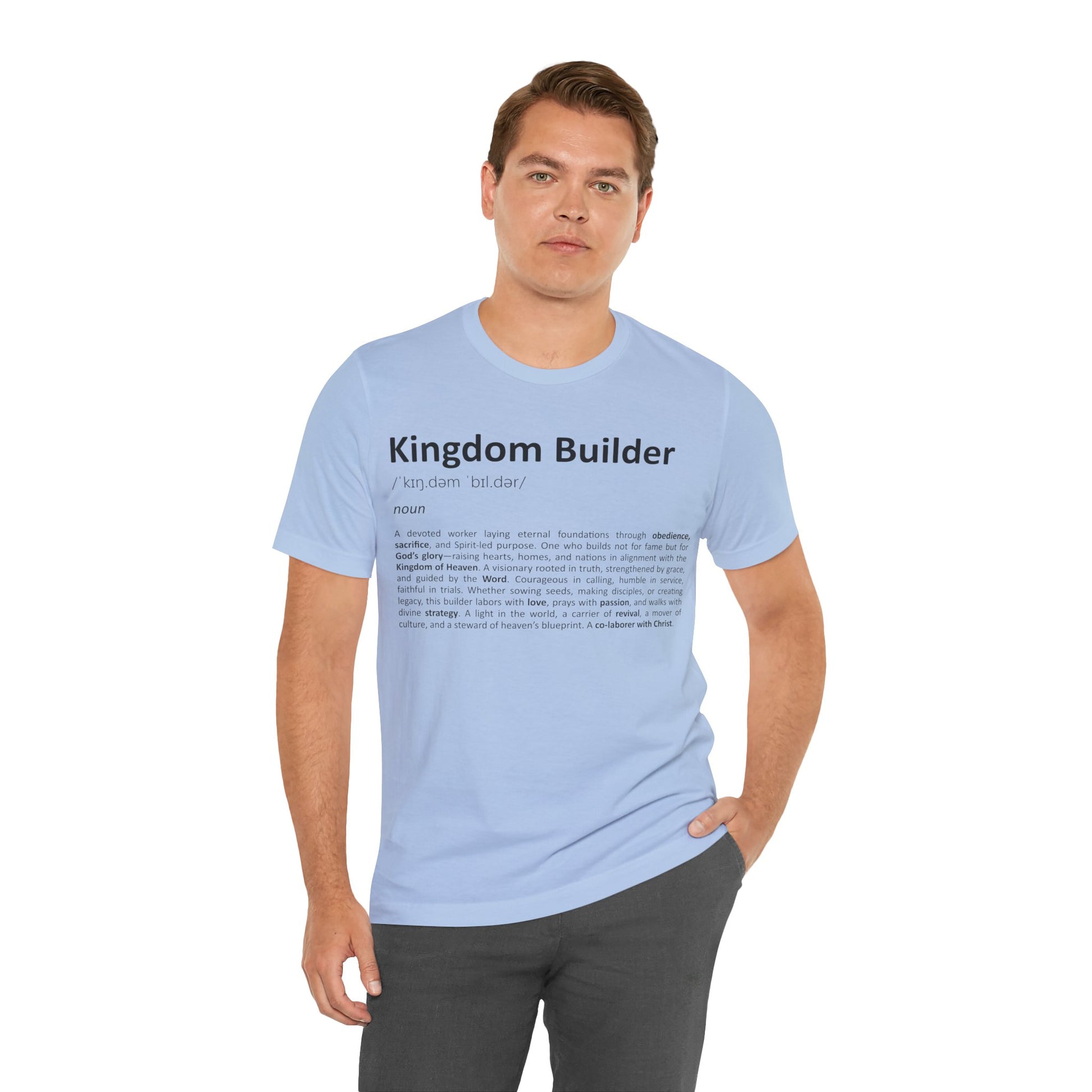 Man wearing a light blue t-shirt with 'Kingdom Builder' text on a white background