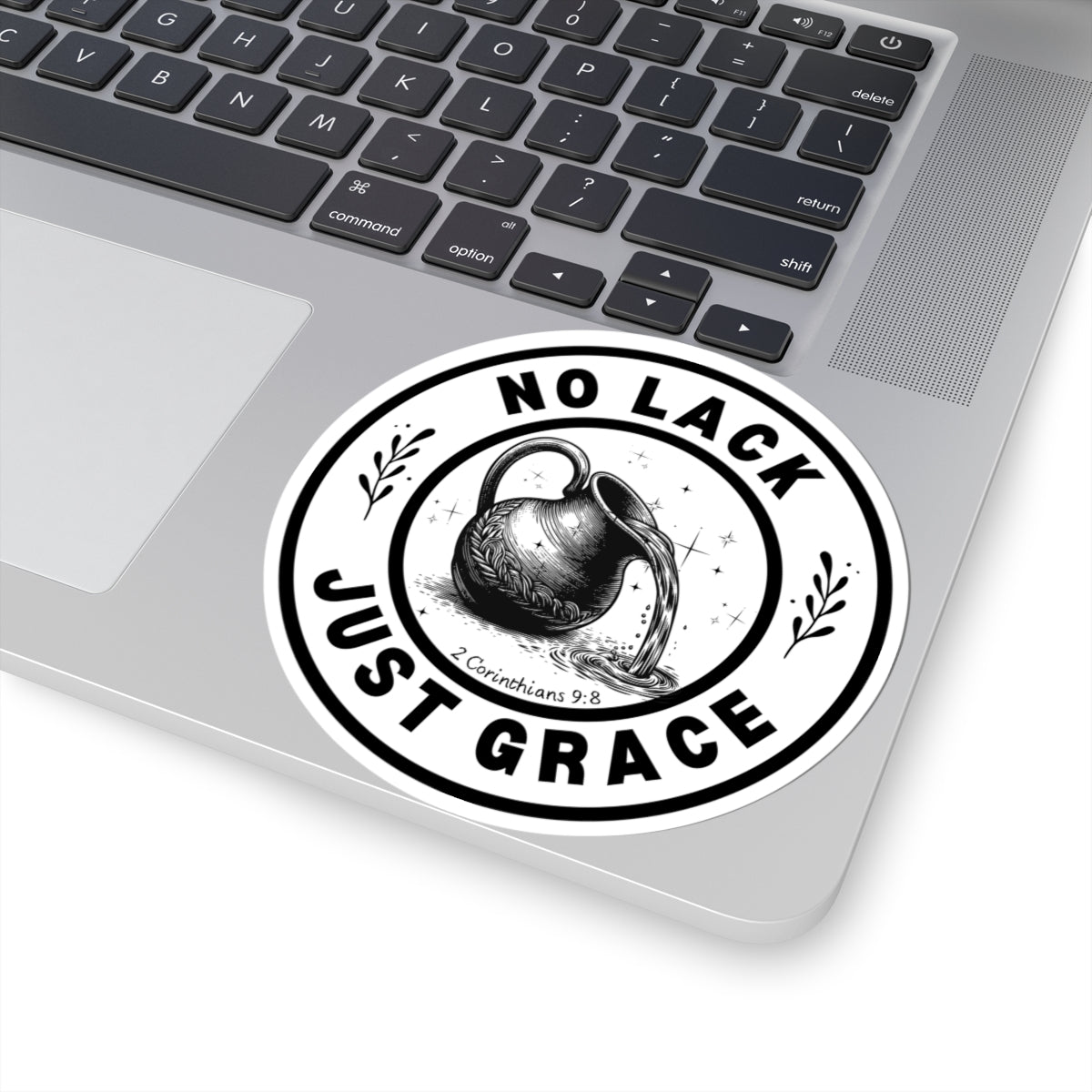 Sticker with 'No Lack Just Grace' design on a laptop
