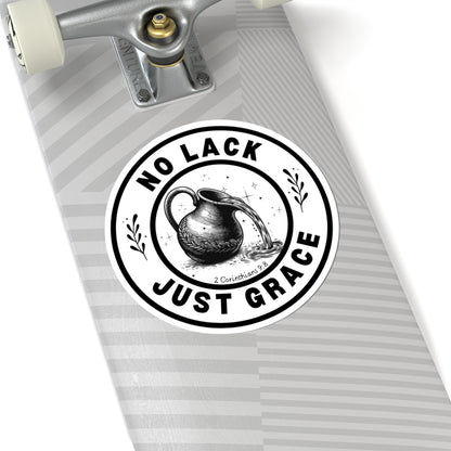 Skateboard with a 'No Lack Just Grace' sticker on a white background