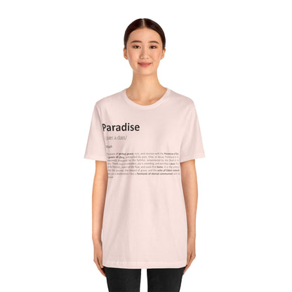 Person wearing a light pink t-shirt with text on a white background