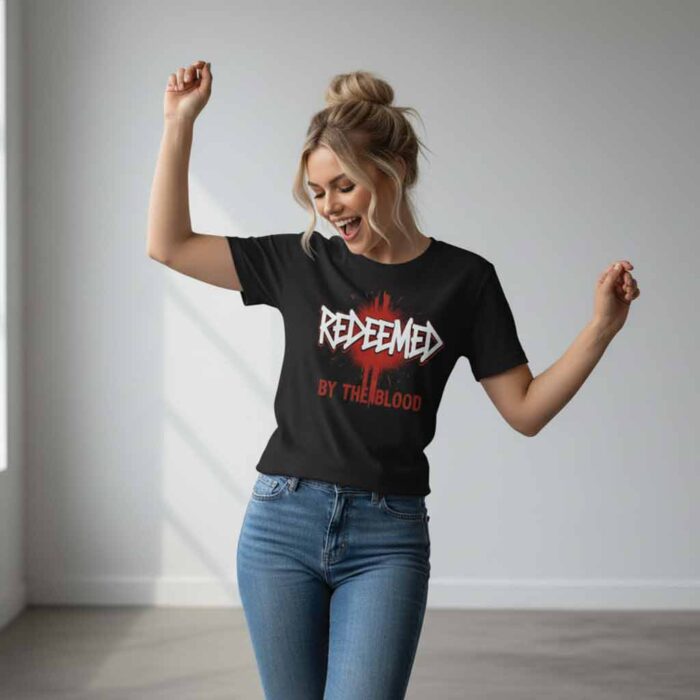 it is dancing time with the Redeemed by the blood black bold statement t-shirt on a beautiful young woman