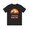 Jesus Reigns Here Unisex Faith Apparel featuring NYC skyline silhouette and sunset, faith-inspired urban design