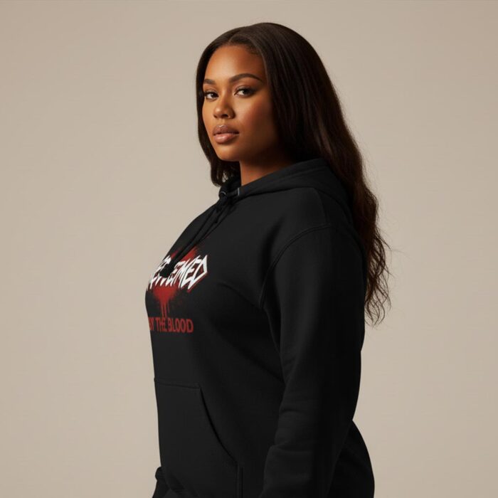 Unisex-Christian-hoodie-featuring-“Redeemed-by-the-Blood”-text-design-with-bold-typography-and-subtle-red-accent-symbolizing-salvation-through-Christ3